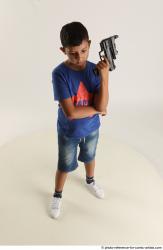 TIMBO STANDING POSE WITH GUN